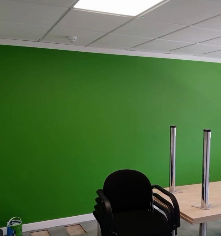 Completed green meeting room wall and suspended ceiling in a Bridgwater office