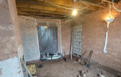 Room stripped back to brick and floor excavated during a house renovation in Stoke St Gregory