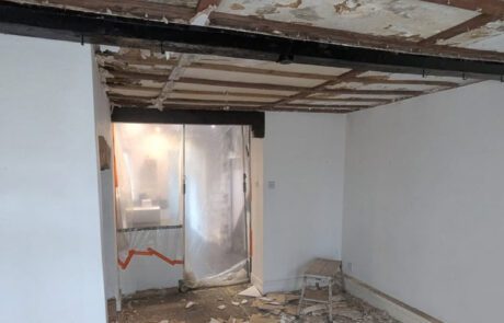 Lounge in Bridgwater during strip out with the ceiling removed and floor exposed